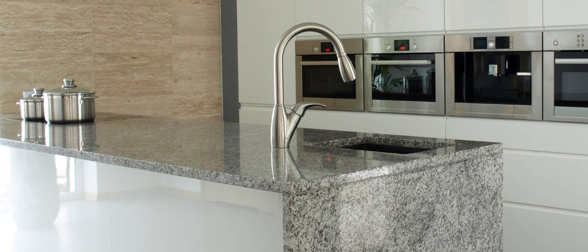 The Pros And Cons Of Granite Countertops 5 pros and cons of granite countertops granite kitchen countertops island with waterfall panel countertops