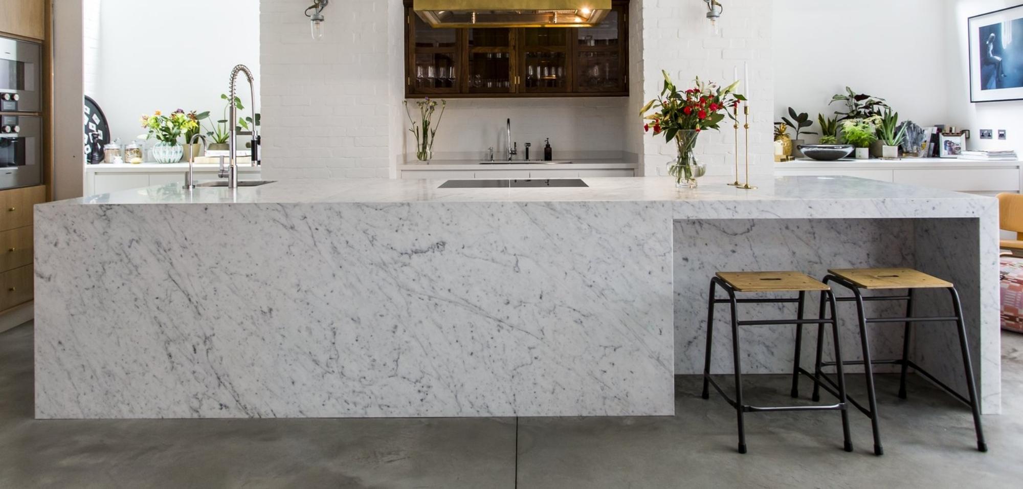 Quartz Vs Marble Countertops: Which Is Better? 5 Carrera White Marble Kitchen Countertops and Island with Waterfall Panel Front