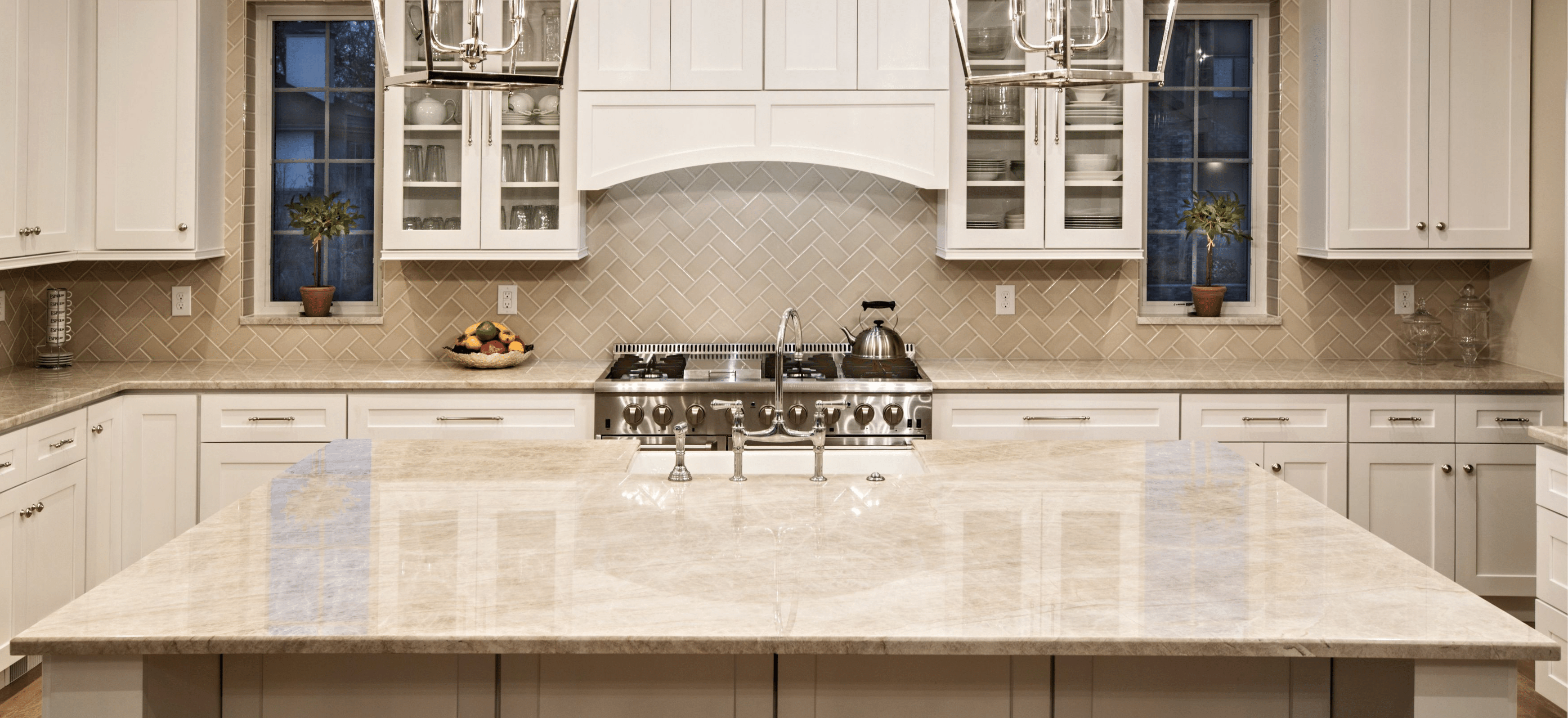 One Of A Kind: A Complete Guide To Natural Stone Countertops 6 Taj Mahal Quartzite Kitchen Countertops and Island with Cream Subway Tile Backsplash Natural Stone Countertops